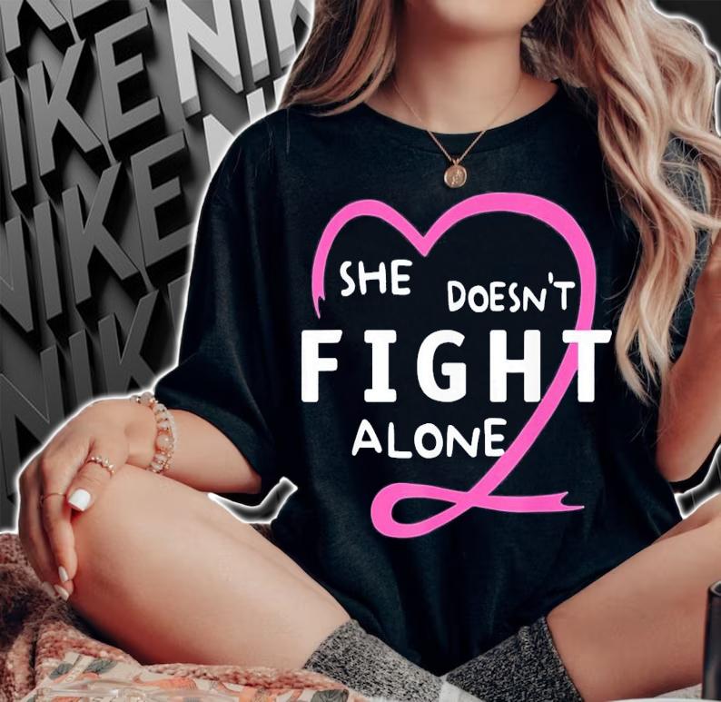 She Doesn't Fight Alone Breast Cancer Awareness Support T-Shirt t-shirt